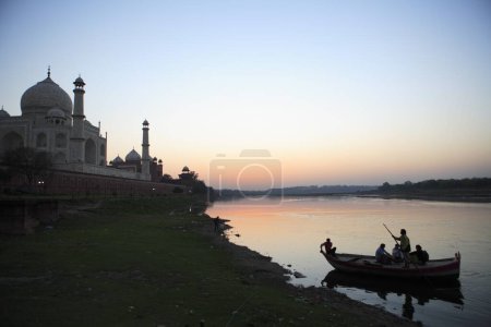 Photo for Sunset view of Taj Mahal Seventh Wonders of World on south bank of Yamuna river , Agra , Uttar Pradesh , India UNESCO World Heritage Site - Royalty Free Image