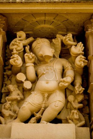 Photo for Small statue of Ganesha adorning one of the niches in Vishwanath temple in Khajuraho , Madhya Pradesh , India - Royalty Free Image