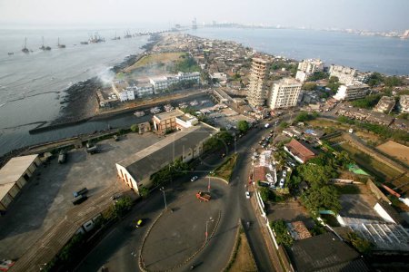 An aerial view of Worli village and headquarters of the Mumbai Coast with backdrop of Bandra Worli sea link , Bombay now Mumbai , Maharashtra , India