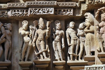 Photo for Khajuraho ornate carved sculptures on wall of lakshmana temple madhya pradesh India - Royalty Free Image