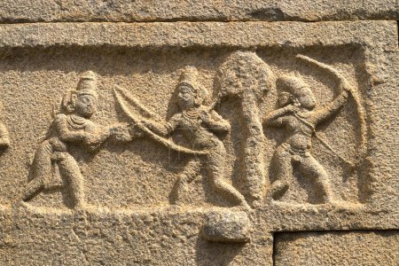 Rama and Lakshmana sculptures on outer wall of Ramachandra temple in Hampi , Karnataka , India
