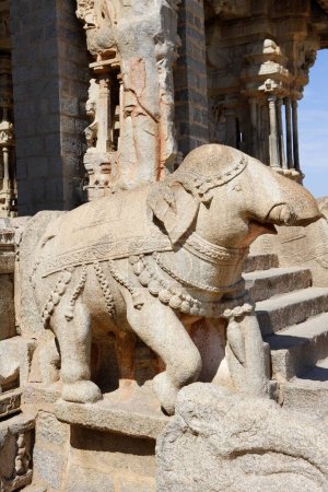 Statue of Elephant on main entrance of dolostava mandapa or musical hall , Vitthala temple complex , Hampi , Vijayanagar , Deccan plateau , Taluka Hospet , District Bellary , Karnataka , India