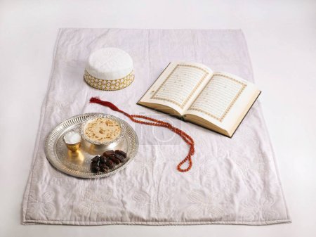 Photo for Koran prayer beads shawl mass Allah bohri Muslim topi cap eid ul_fitr or id_ul_fitr with sewaiya khajoor salt for Id festival - Royalty Free Image