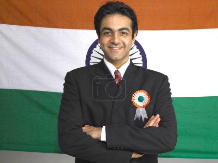 Executive folded hands standing in front of national flag of India 