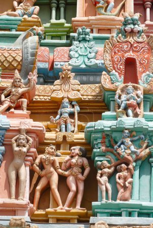 Lord Krishna in various activities carved on Ranga gopuram gateway of gigantic Sri Ranganathswami temple , Srirangam , Tiruchirapalli Trichy , Tamil Nadu , India