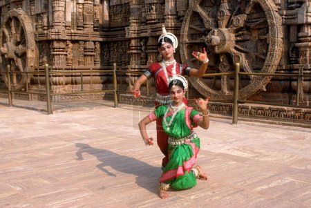 Photo for Dancers performing classical traditional odissi dance at Konarak Sun temple, Konarak, Orissa - Royalty Free Image
