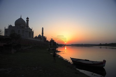 Photo for Sunset view of Taj Mahal Seventh Wonders of World on south bank of Yamuna river , Agra , Uttar Pradesh , India UNESCO World Heritage Site - Royalty Free Image