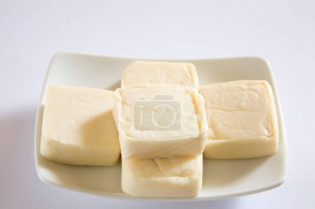 Photo for Cheese pressed into firm or hard mass home or dairy product - Royalty Free Image