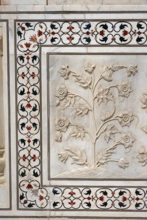 Photo for Marble inlay work of interlocking and lower walls sculpted realistic bas relief depictions of flowers at Taj Mahal Seventh Wonders of World , Agra , Uttar Pradesh , India UNESCO World Heritage Site - Royalty Free Image