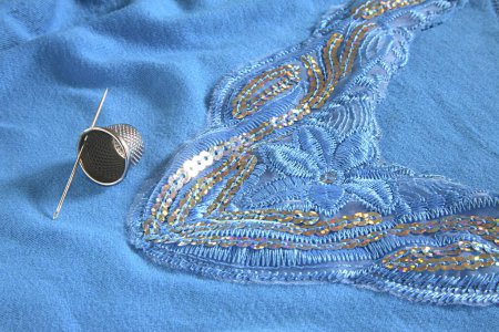 Photo for Concept , thimble with needle kadhai art of embroidery on cloth - Royalty Free Image