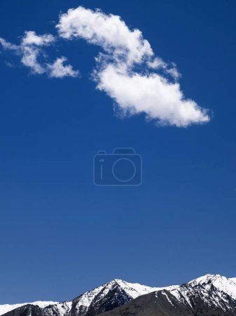 White cloud formation against blue skies