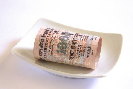 Photo for Concept , Indian currency one thousand rupees in plate - Royalty Free Image