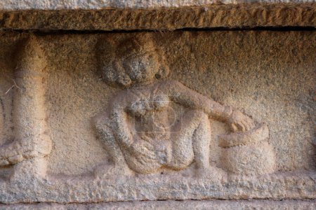 Erotic statue carved on pillar in hundred pillared mandapa , Vitthala temple complex , Hampi , Vijayanagar , , Deccan plateau , Taluka Hospet , District Bellary , Karnataka , India