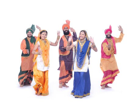 Foto de Dancers performing folk dance bhangra - Imagen libre de derechos