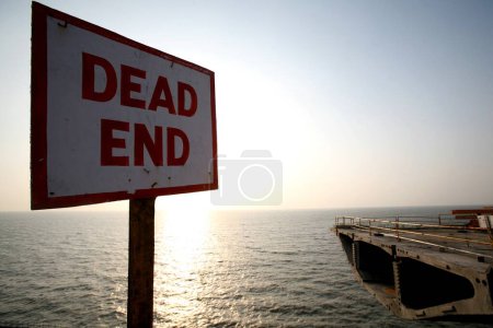 A dead end placard at the construction site of the Bandra Worli Sea link on Arabian Sea in Western suburb of Bombay now Mumbai , Maharashtra , India