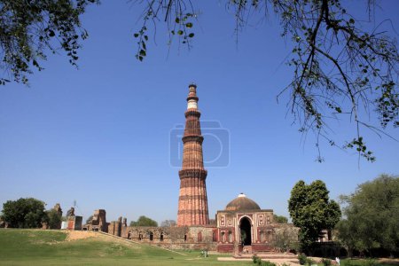 Photo for Alai Darwaza and Qutab Minar built in 1311 red sandstone tower , Delhi , India UNESCO World Heritage Site - Royalty Free Image