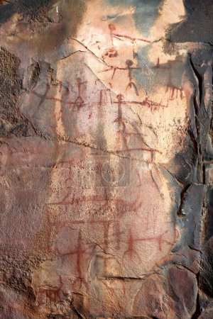 Photo for Cave paintings showing men on rock shelters no 3 ten thousands years old at Bhimbetka near Bhopal , Madhya Pradesh , India - Royalty Free Image