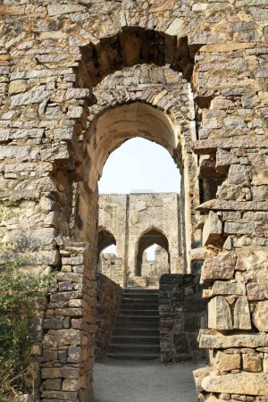 Golconda fort built by Mohammed Quli Qutb Shah 16th century view of inside hall with broken columns and arches , Hyderabad , Andhra Pradesh , India