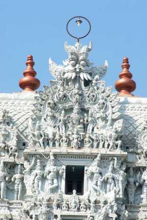 Photo for Gopuram of temple covered with statues richly decorated facade of Thanumalayan at Suchindram 11 kilometres from Kanyakumari , Tamil Nadu , India - Royalty Free Image