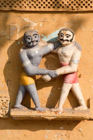 Photo for Sculpture of wrestling scene on the wall of swaminarayan temple , Ahmedabad , Gujarat , India - Royalty Free Image