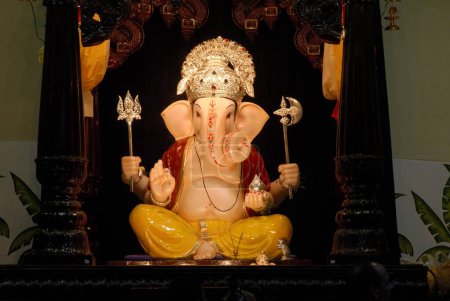 Idol of Lord Ganesh , Elephant Headed God of Hindu worshiping for Ganapati Festival at Deccan , Pune , Maharashtra , India , Asia