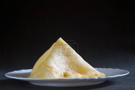 Photo for Fast food rawa masala dosa served in dish on black background 19-May-2010 - Royalty Free Image