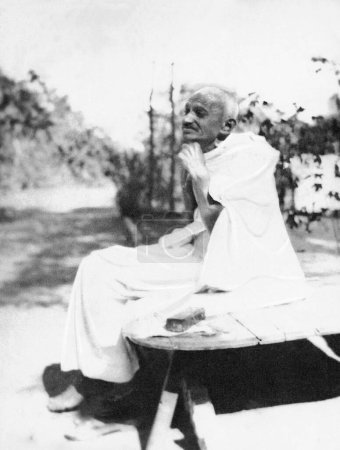 Photo for Mahatma Gandhi shaving without a mirror, Sabarmati Ashram, Ahemedabad, Gujarat, India, 1921. - Royalty Free Image