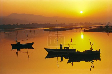 Photo for Fisherman boats marooned at sunrise, alibaug, Maharashtra, India, Asia - Royalty Free Image