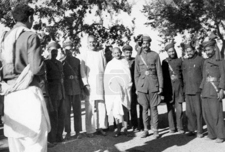 Photo for Khan Abdul Gaffar Khan and Mahatma Gandhi with khudai khidmadgars red shirts , nonviolent soldiers during Mahatma Gandhis visit to the North West Frontier Provinces to Afghanistan , October 1938 - Royalty Free Image