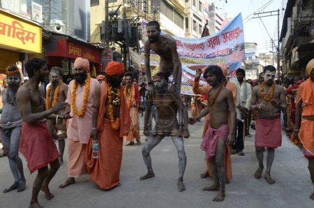 Naked priest doing acrobatics in Varanasi Uttar Pradesh India