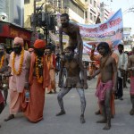 Naked priest doing acrobatics in Varanasi Uttar Pradesh India 
