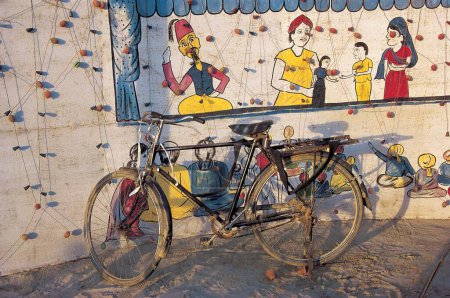 Photo for Bicycle at wall painting - Royalty Free Image