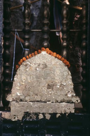 Holy stone with thin gold plate, Bodh Gaya, Bihar, India, Asia