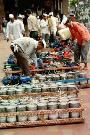 Photo for Tiffinwala or dabbawala arranging lunchboxes in crate, Bombay Mumbai, Maharashtra, India - Royalty Free Image