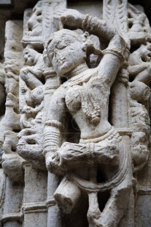 Photo for Statue of female musician playing Mridangam in dancing pose 2000 years old ancient monument in Adinath Jain temple heritage ; Village Dilwara ; Udaipur ; Rajasthan ; India - Royalty Free Image