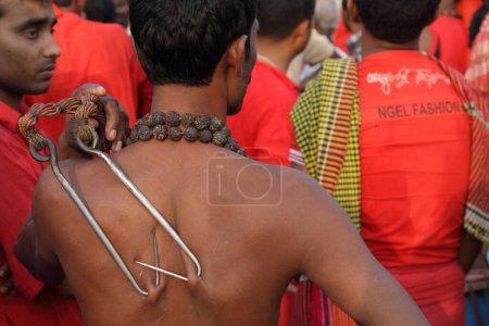 Photo for Devotees hooks pierced on back, charak pooja, west bengal, india, asia - Royalty Free Image
