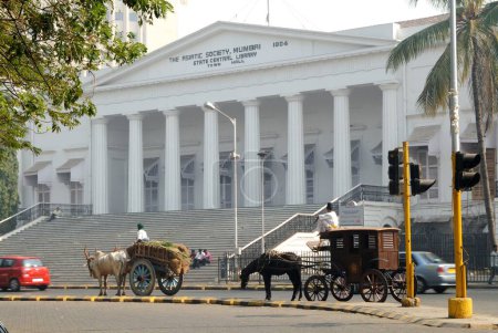Bullock cart and horse driven cart standing in front of The Asiatic Society State Central Library Town Hall ; Bombay Mumbai ; Maharashtra ; India