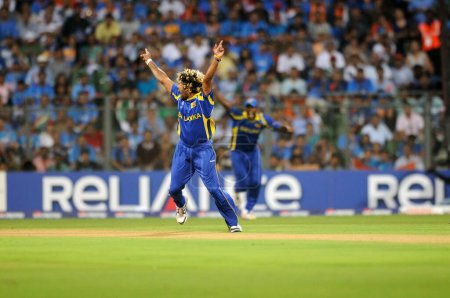 Photo for Sri Lankan bowler Lasith Malinga celebrate wicket of Indian batsman Virendra Sehwag Not in picture during the 2011 ICC World Cup Final between India and Sri Lanka at Wankhede Stadium on April 2 2011 in Mumbai India - Royalty Free Image
