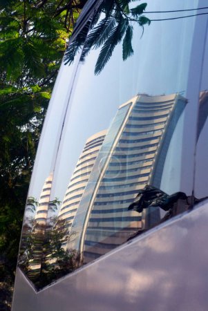 Reflection of Bombay Stock Exchange building in glass of tourist bus at Kala Ghoda  ; Fort  ; Bombay Mumbai  ; Maharashtra  ; India