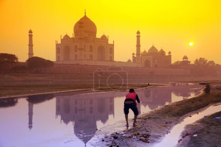 Photo for Reflection of Taj Mahal in Yamuna river at sunset ; Agra ; Uttar Pradesh ; India - Royalty Free Image