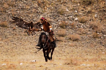 eagle hunters at golden eagle festival, bayan, olgii, mongolia