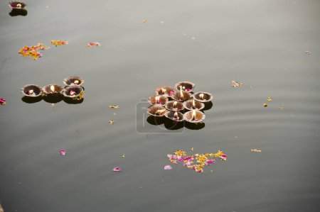 Photo for Oil lamp floating on river, mathura, uttar pradesh, india, asia - Royalty Free Image