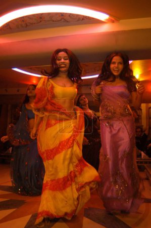 Photo for Decked up girls dancing in bar, Bombay Mumbai, Maharashtra, India - Royalty Free Image