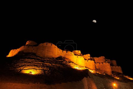 Nightview of half moon above fort of Jaisalmer ; Rajasthan ; India