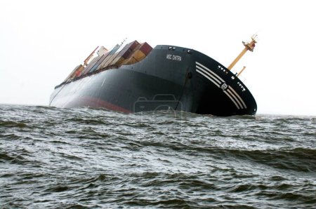 Foto de Container ship chitra tilted dangerously colliding in sea ; Bombay Mumbai ; Maharashtra ; India 9-August-2010 - Imagen libre de derechos