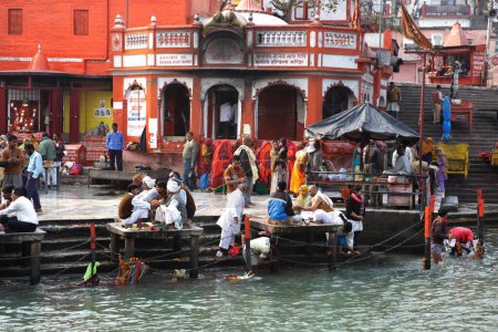 Photo for People performing rituals on banks of river Ganga, Haridwar, Uttaranchal Uttarakhand, India - Royalty Free Image