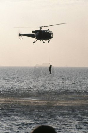 Photo for Life saving demonstration by air force, bombay mumbai, maharashtra, india - Royalty Free Image