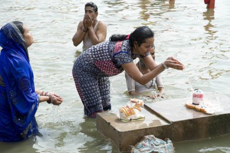 Photo for Woman offering water on shivling, ujjain, madhya pradesh, india, asia - Royalty Free Image