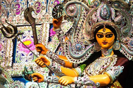 Photo for Goddess durga warrior pose with divine weapons on durga pooja , Calcutta Kolkata , West Bengal , India - Royalty Free Image