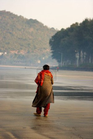 Photo for Lady alone at Murud Janjira coast ; District Raigad ; Maharashtra ; India - Royalty Free Image